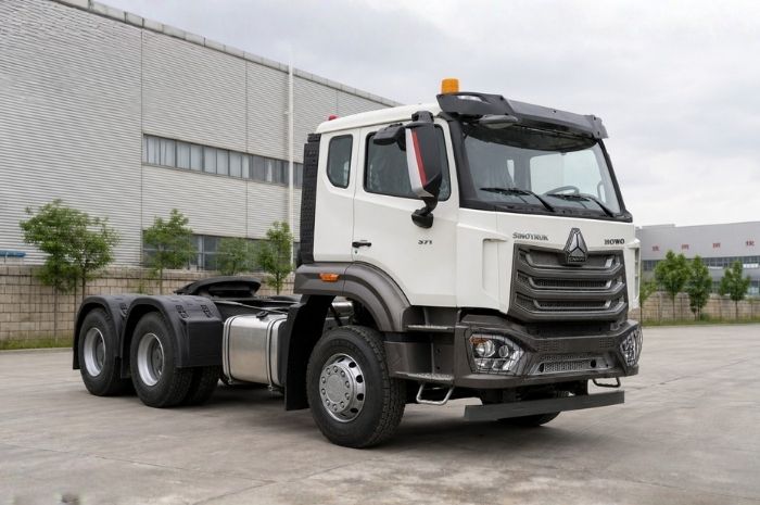 Refurbished HOWO NX 371HP 6x4 tractor truck front three-quarter reference view